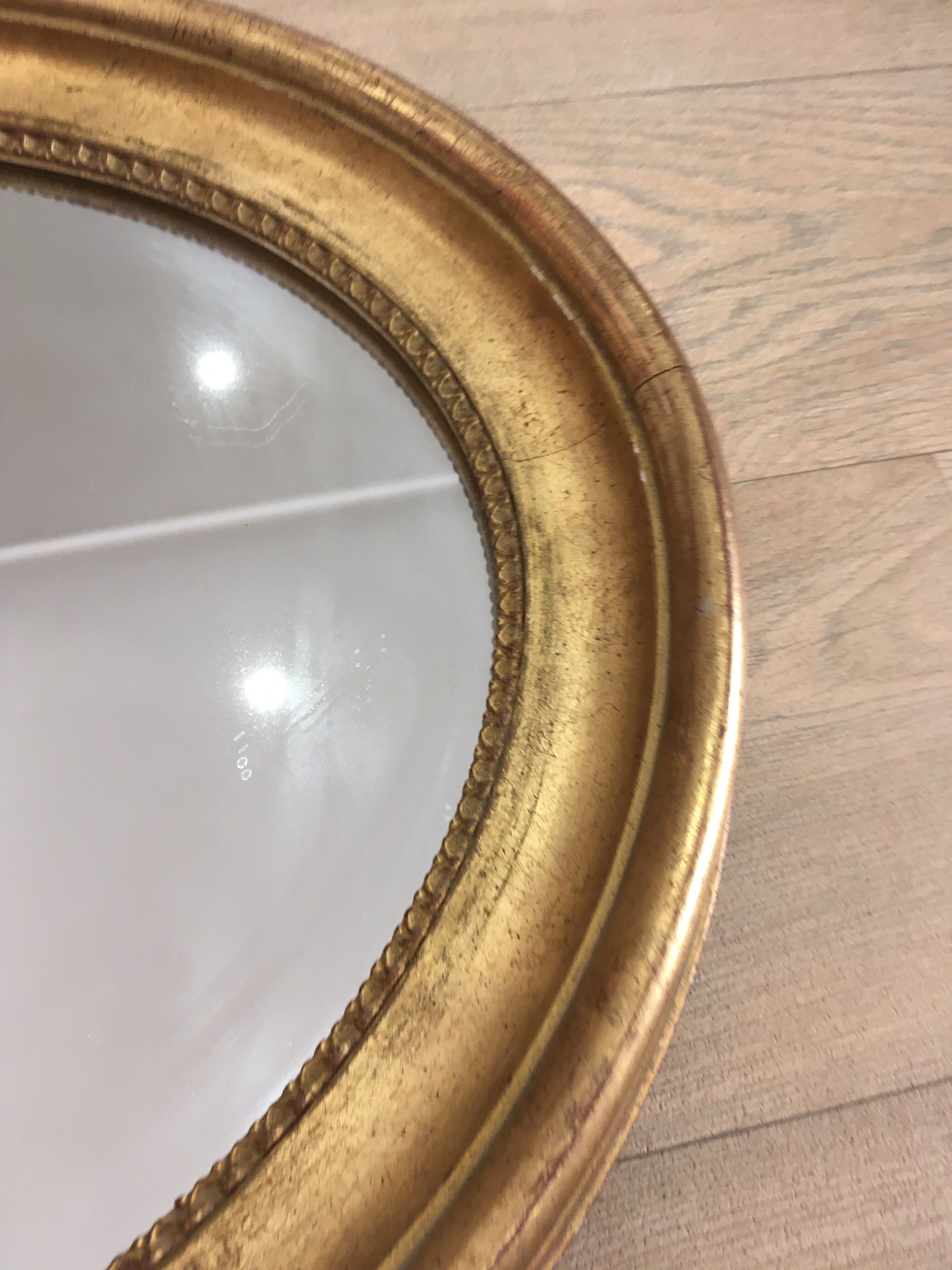 Old mirror gilded wooden frame.