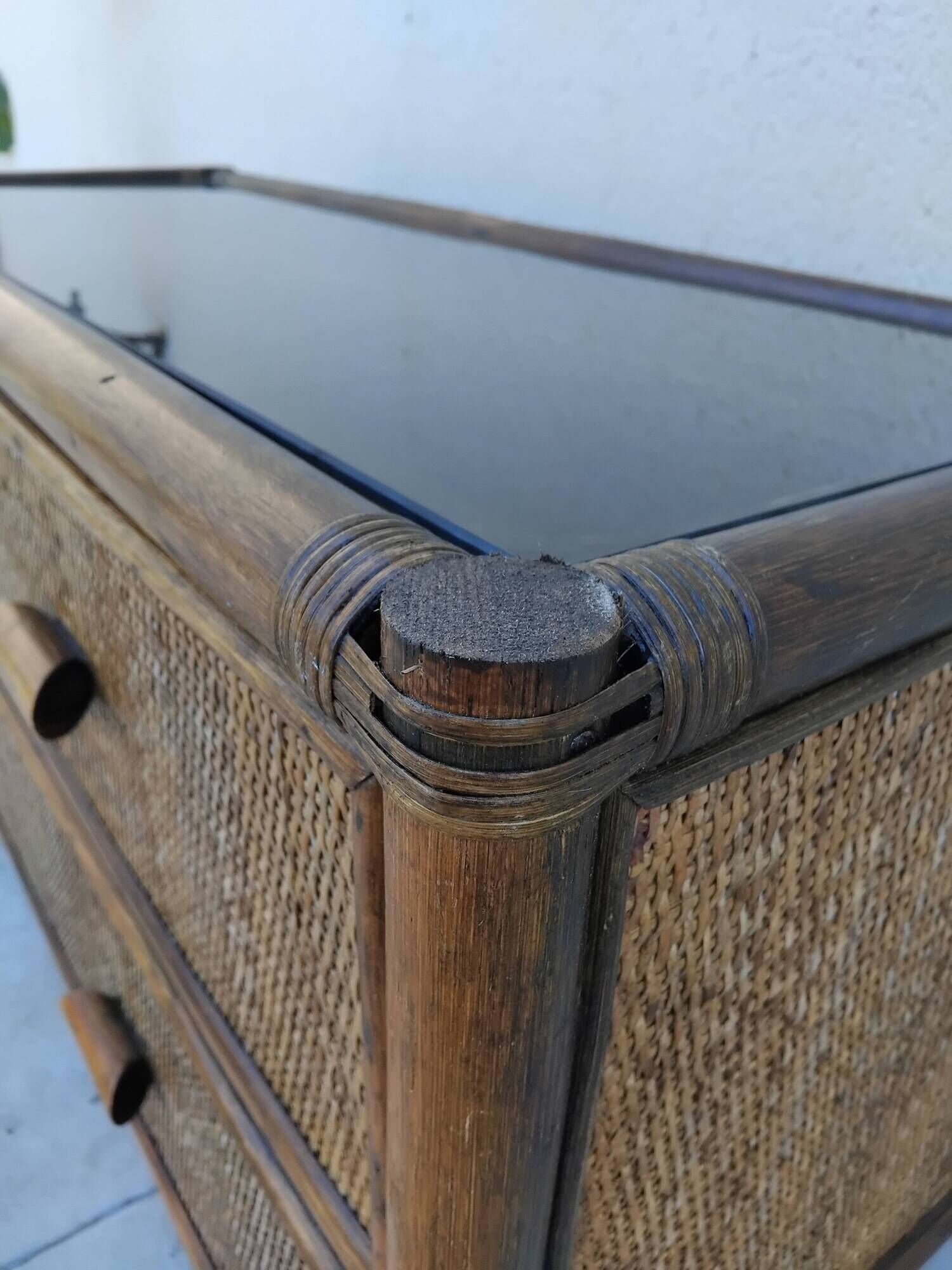 Vintage rattan and glass TV unit.