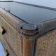 Vintage rattan and glass TV unit.