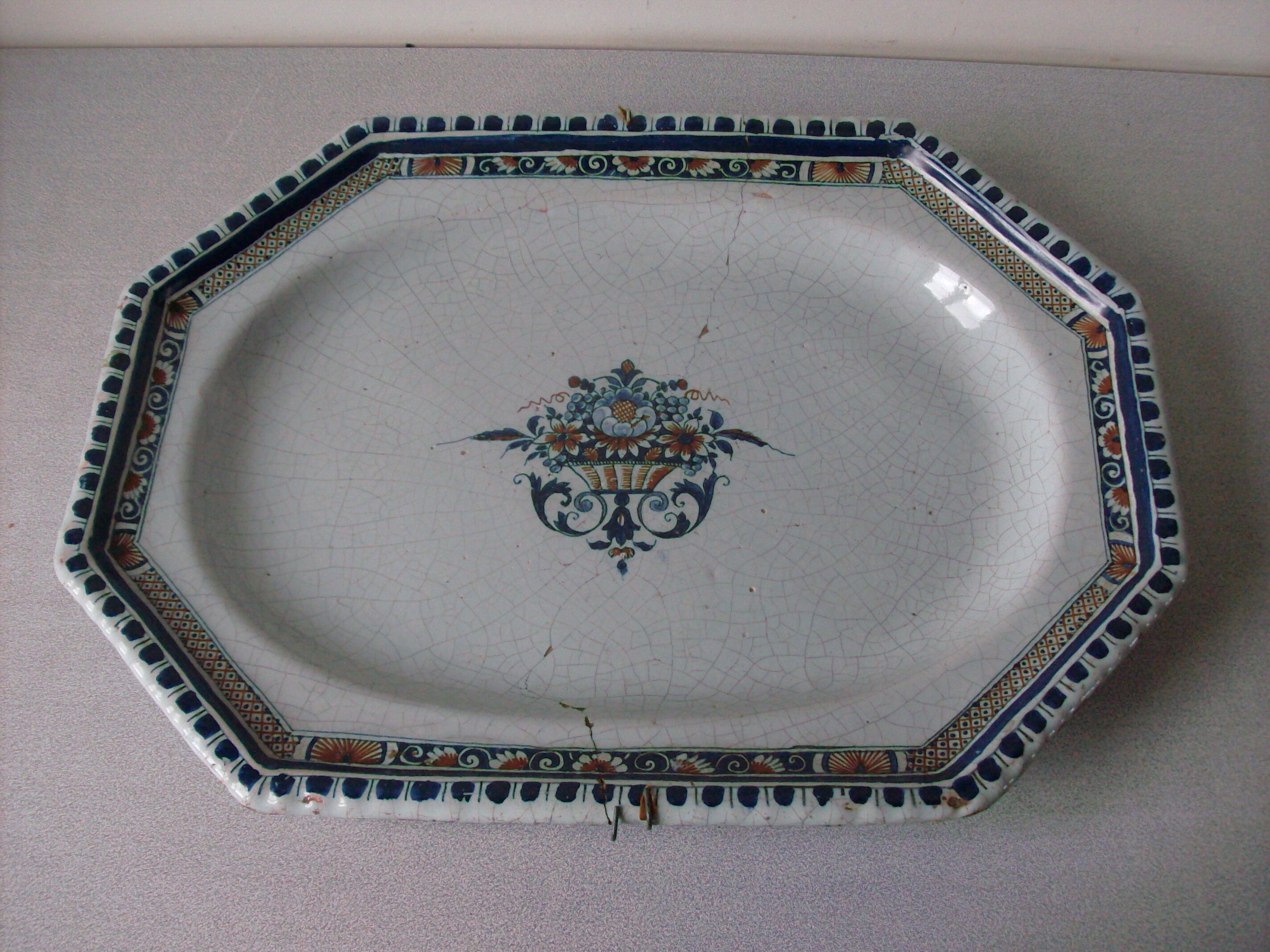Earthenware dish of Rouen polychrome 18th wall mounting system