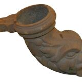 Cast iron gutter downspout in the shape of a dolphin