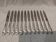 12 silver-plated metal table knives, Platil rocaille silversmith design, 24.6cm