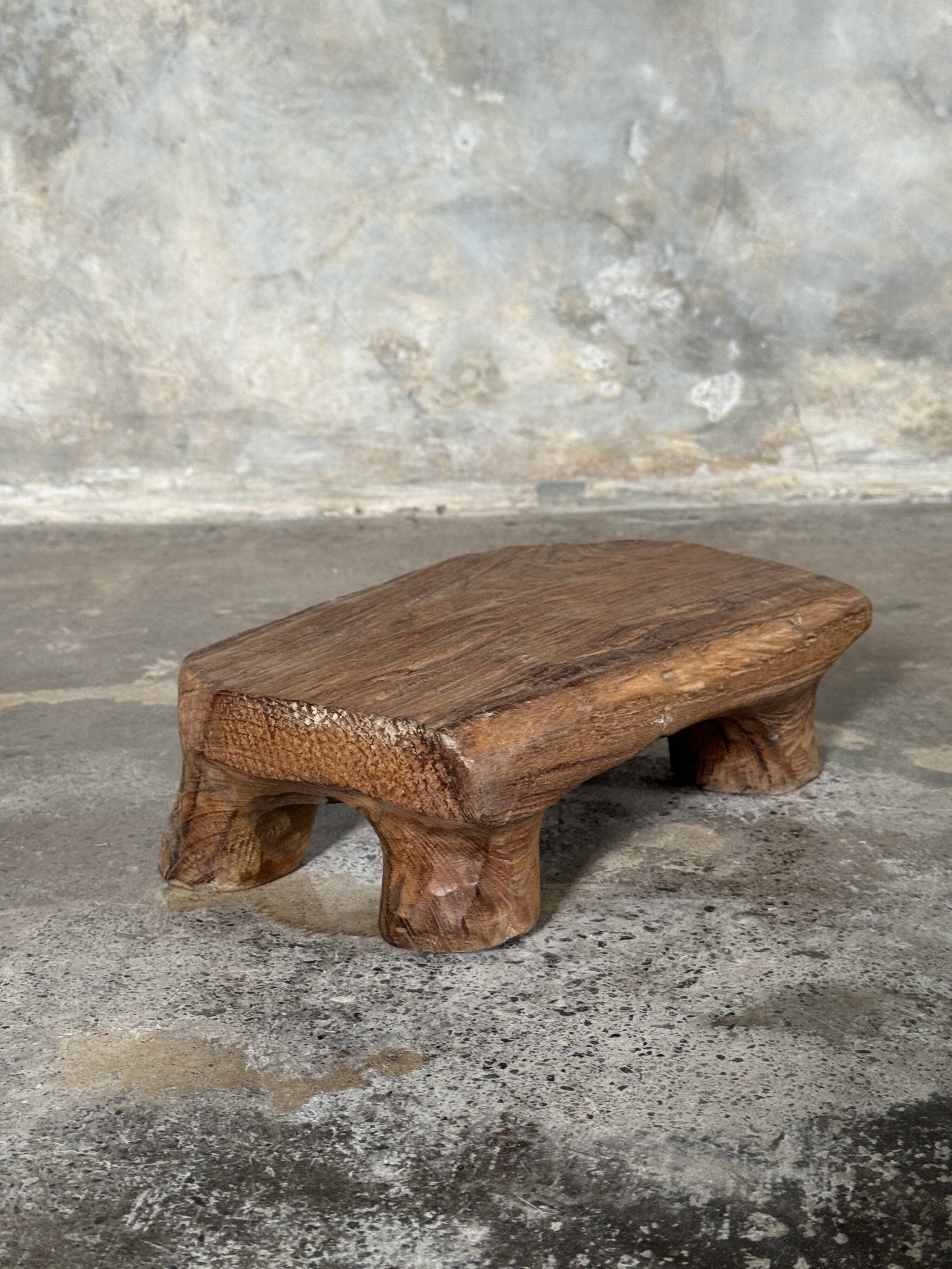 Small stool, teak footrest with short cut corners.