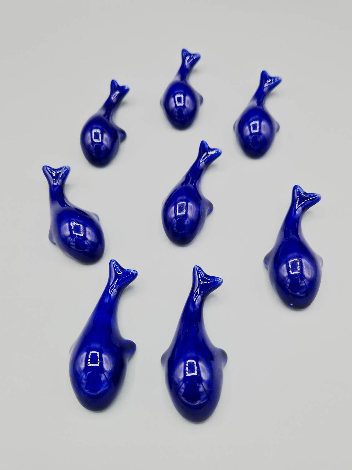 Set of 6 vintage blue porcelain whale knife rests.