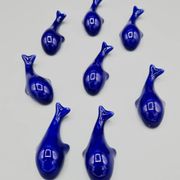 Set of 6 vintage blue porcelain whale knife rests.