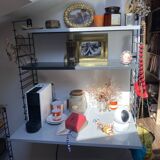 Metal string shelf