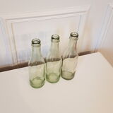 Suite of three old small glass bottles