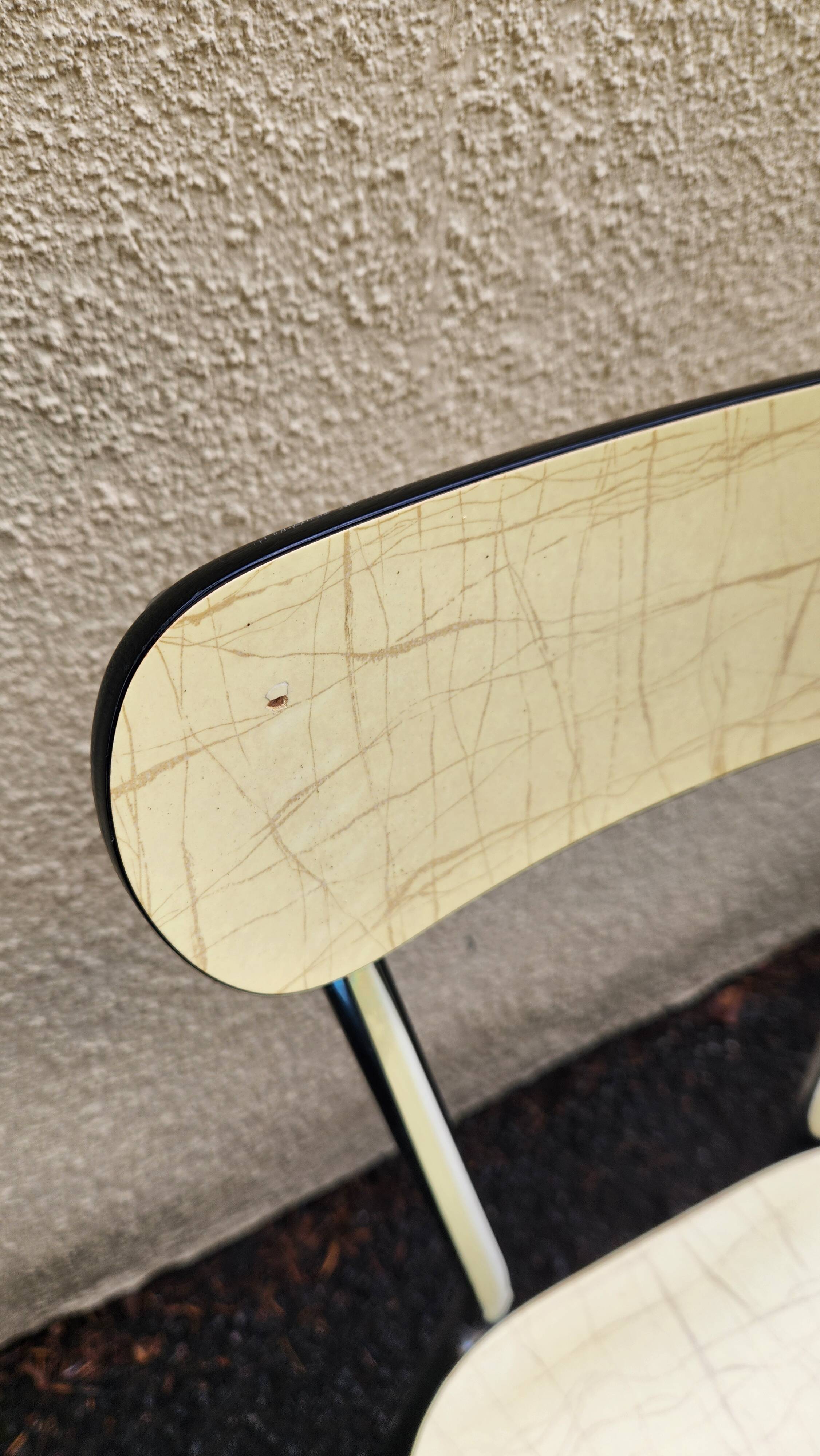 Vintage set from the 60s/70s: table, chairs, and marbled Formica stools.