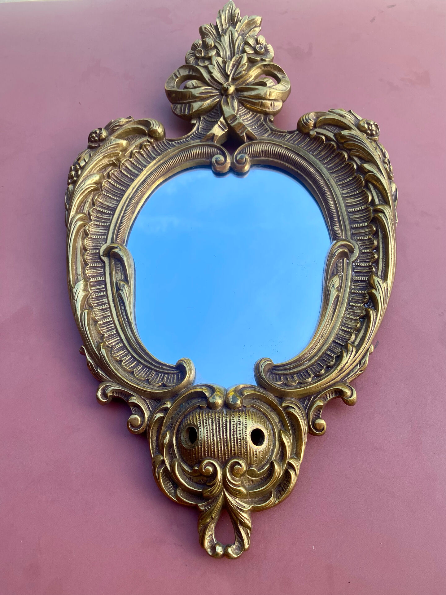 oval decorative wall mirror in Louis XV style