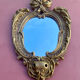 oval decorative wall mirror in Louis XV style
