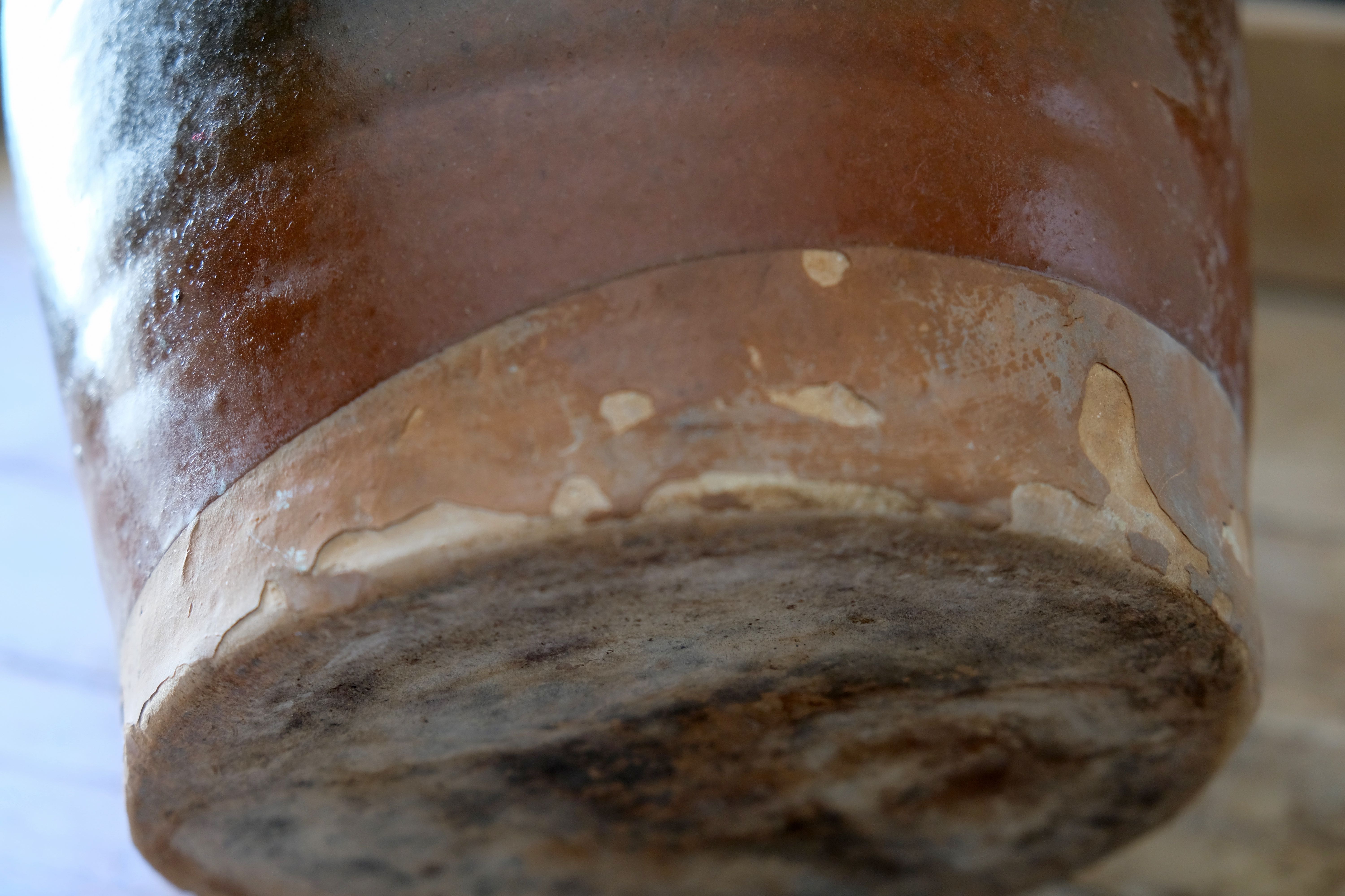 Old glazed terracotta pot