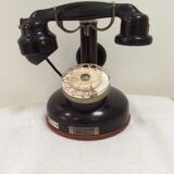 Old Bakelite telephone with column