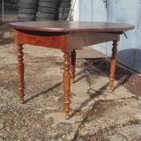 Old extendable round table in fruit wood with folding sides