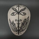 Africanist mask in glazed white terracotta, face signed Colette.