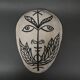 Masque africaniste en terre cuite émaillée blanche visage signé Colette