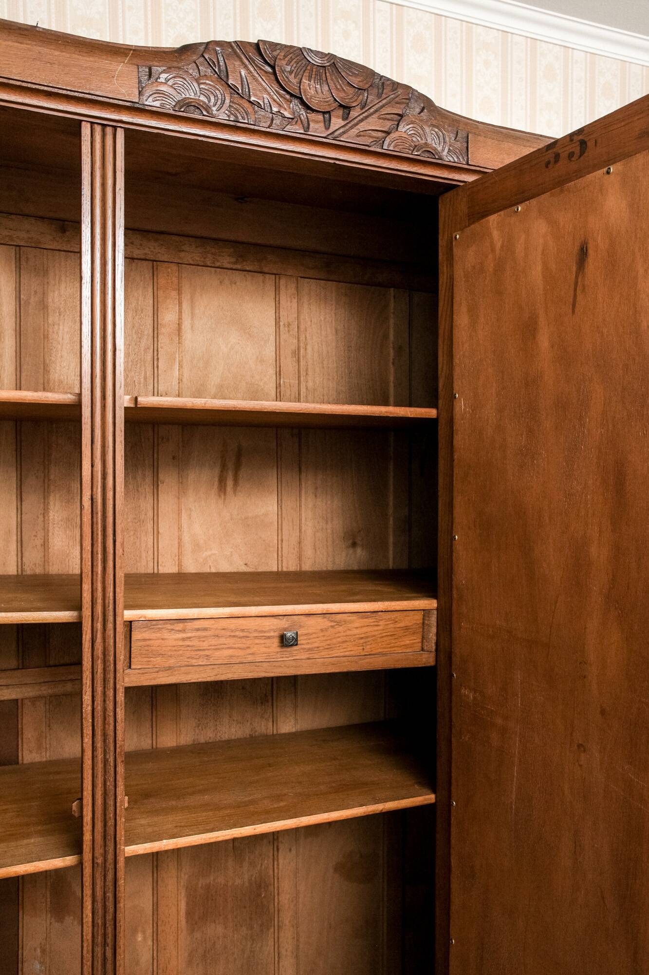 Old solid wood wardrobe with three vintage mirror doors