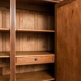 Old solid wood wardrobe with three vintage mirror doors