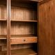 Old solid wood wardrobe with three vintage mirror doors