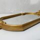 Antique Louis XV style mirror with a vintage carved gold frame.