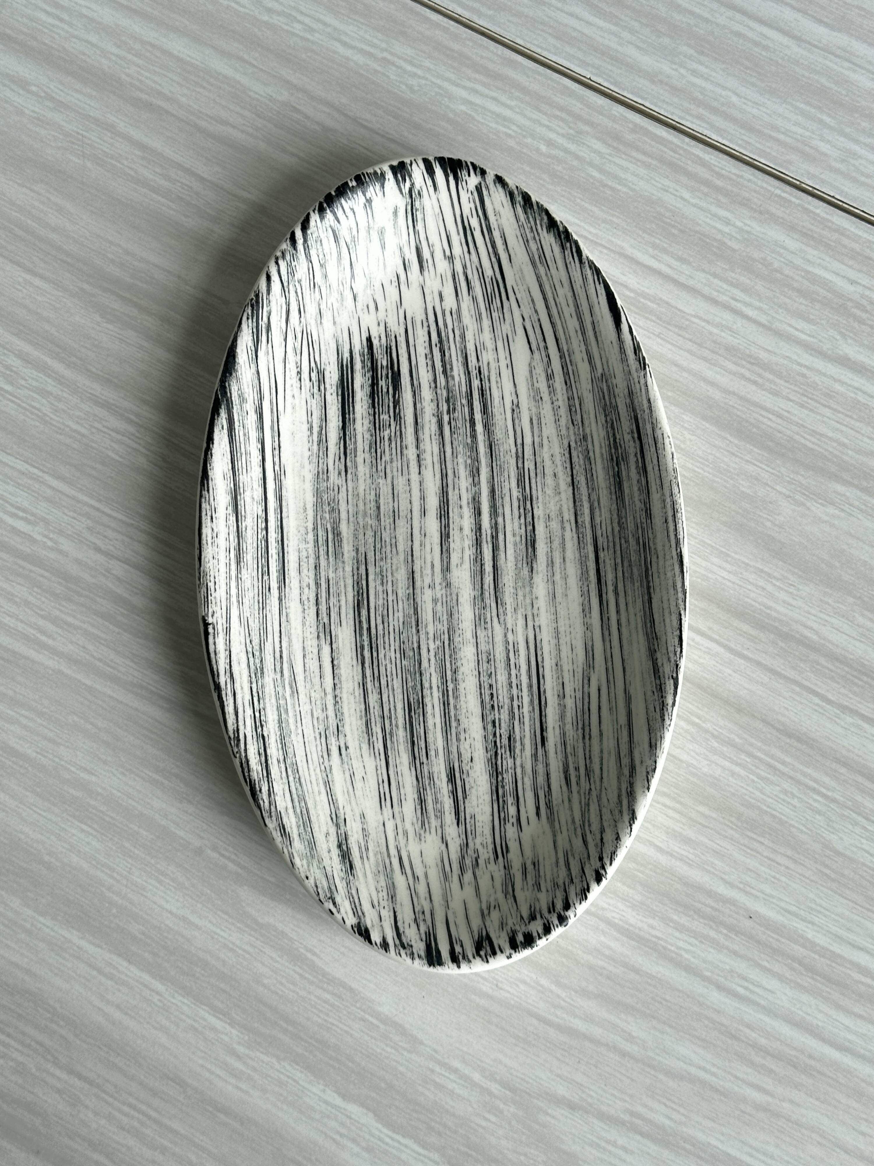 Black and white designer pocket emptier