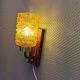 wall lights in rosewood look, with amber coloured glass and brass details.