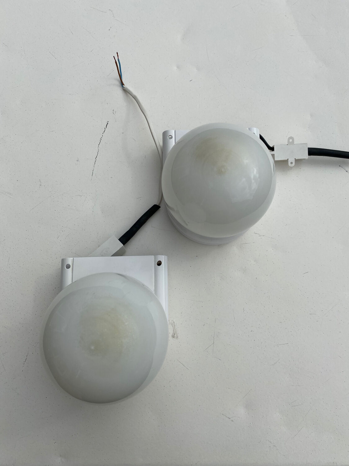 Pair of white and opaline metal wall lights