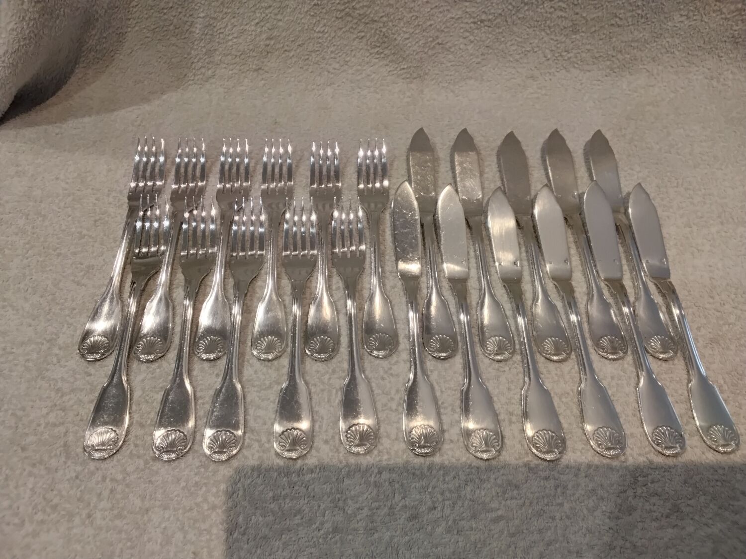 11 silver-plated fish forks and 11 fish knives by Christofle Vendome
