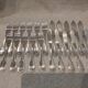11 silver-plated fish forks and 11 fish knives by Christofle Vendome