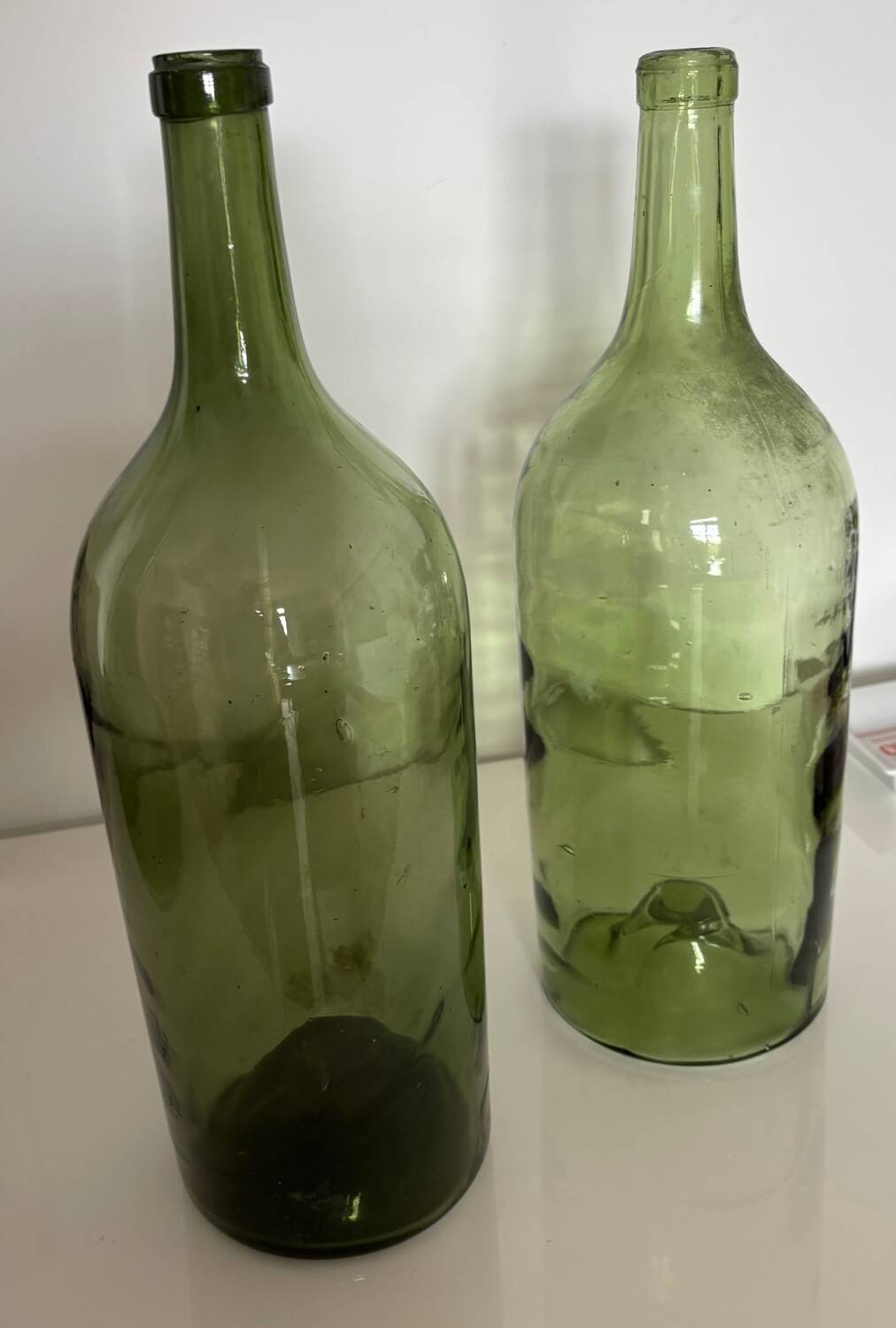 Pair of large antique blown glass bottles