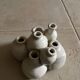 Beige ceramic flower pick