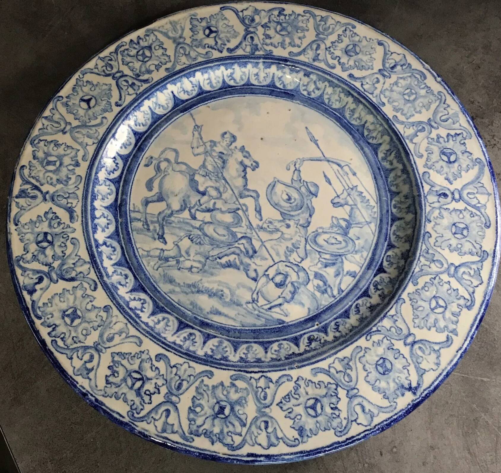 Antique glazed ceramic wall plate with battle scene decoration 41.5 cm