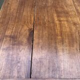 Antique solid cherry farmhouse table with 2 end drawers and 1 pull-out.
