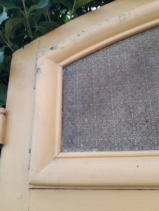19th century double arched entrance door in oak with grilles and old glass