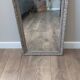 Antique mirror in carved, painted and patinated wood