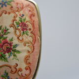 Antique hand mirror with stitched glass