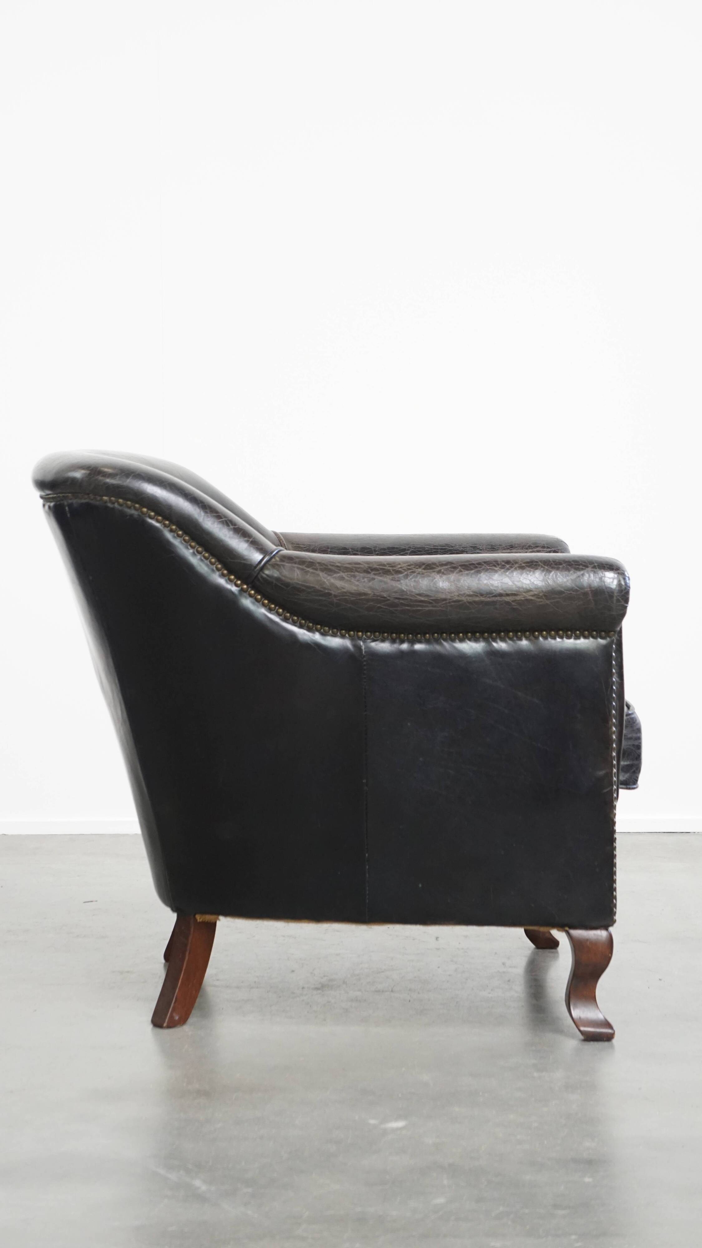 Black grained cowhide leather armchair