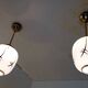 Pair of opaline globe pendant lights with stylized decoration, 1950s