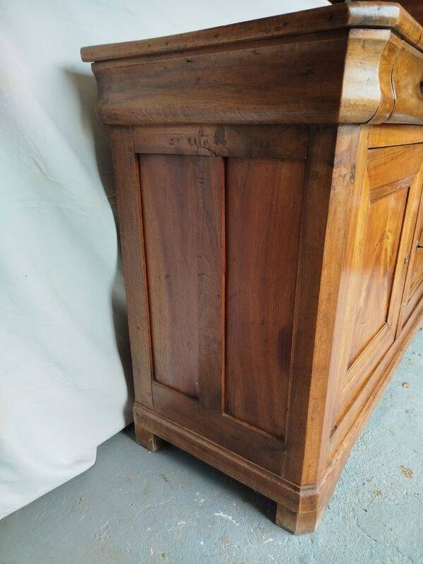 Very old in solid walnut.
