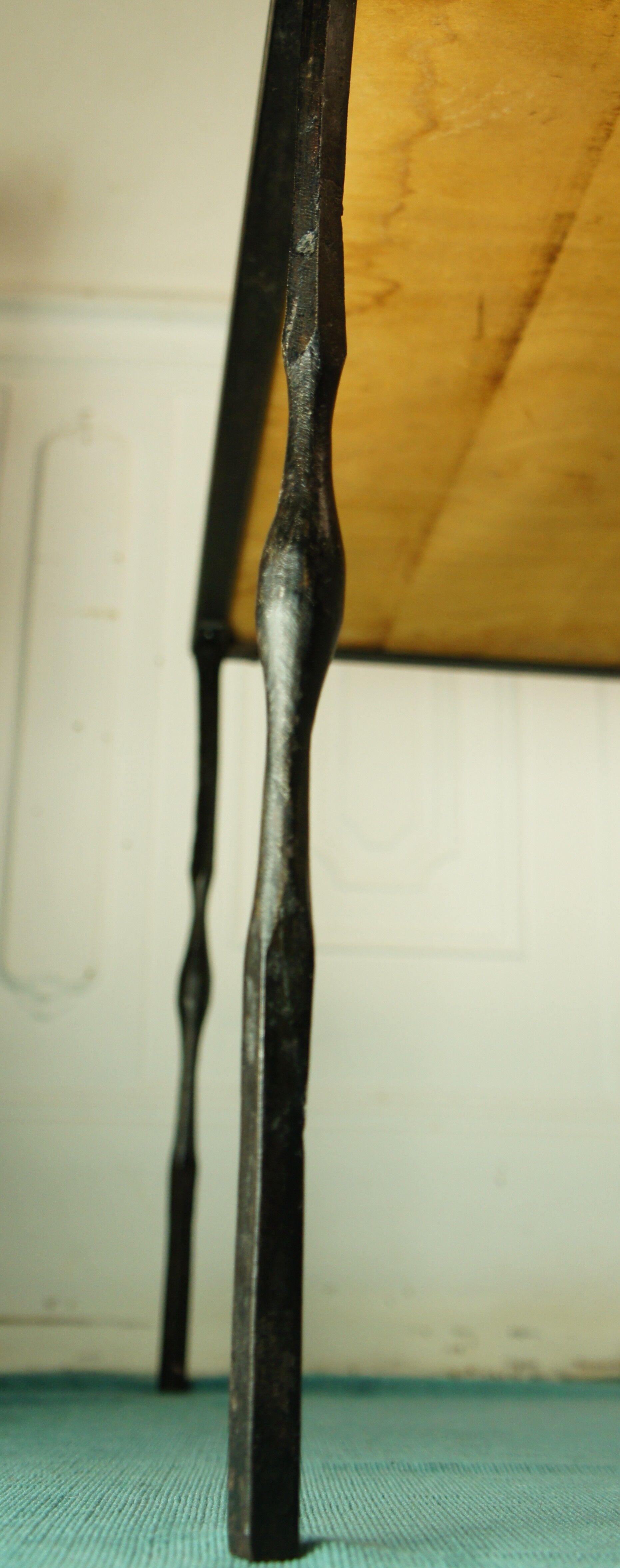 Signed black steel-ceramic side table