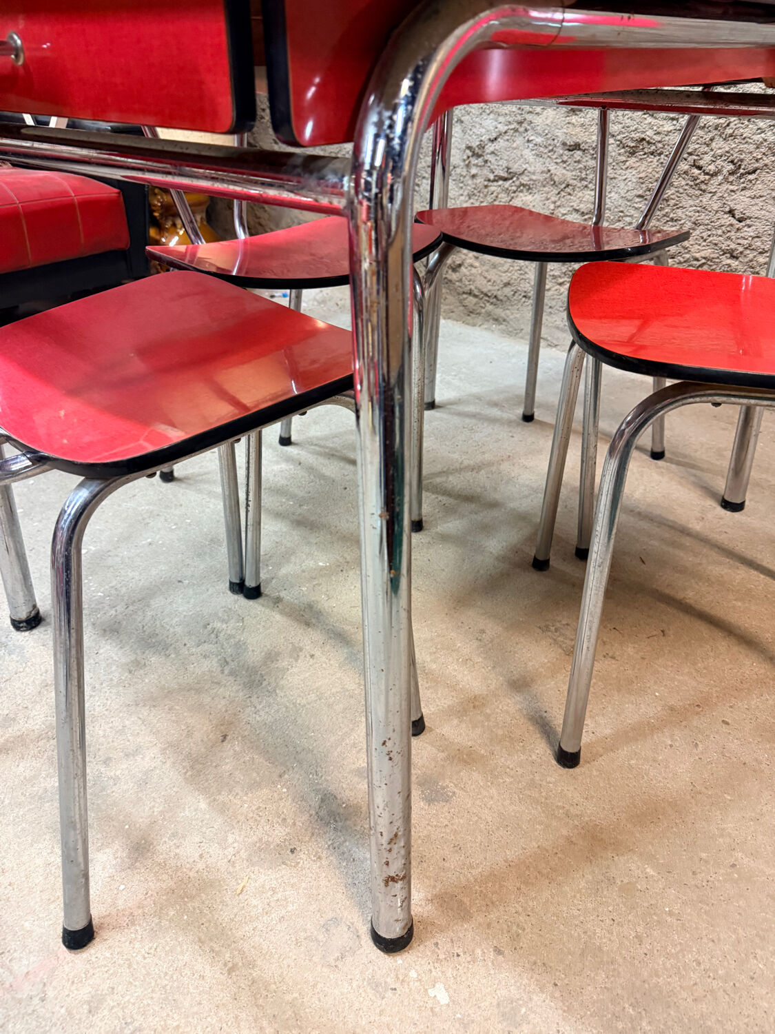 4 red Formica chairs with a 1970s table