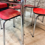4 red Formica chairs with a 1970s table