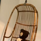 Vintage chair suspended in rattan