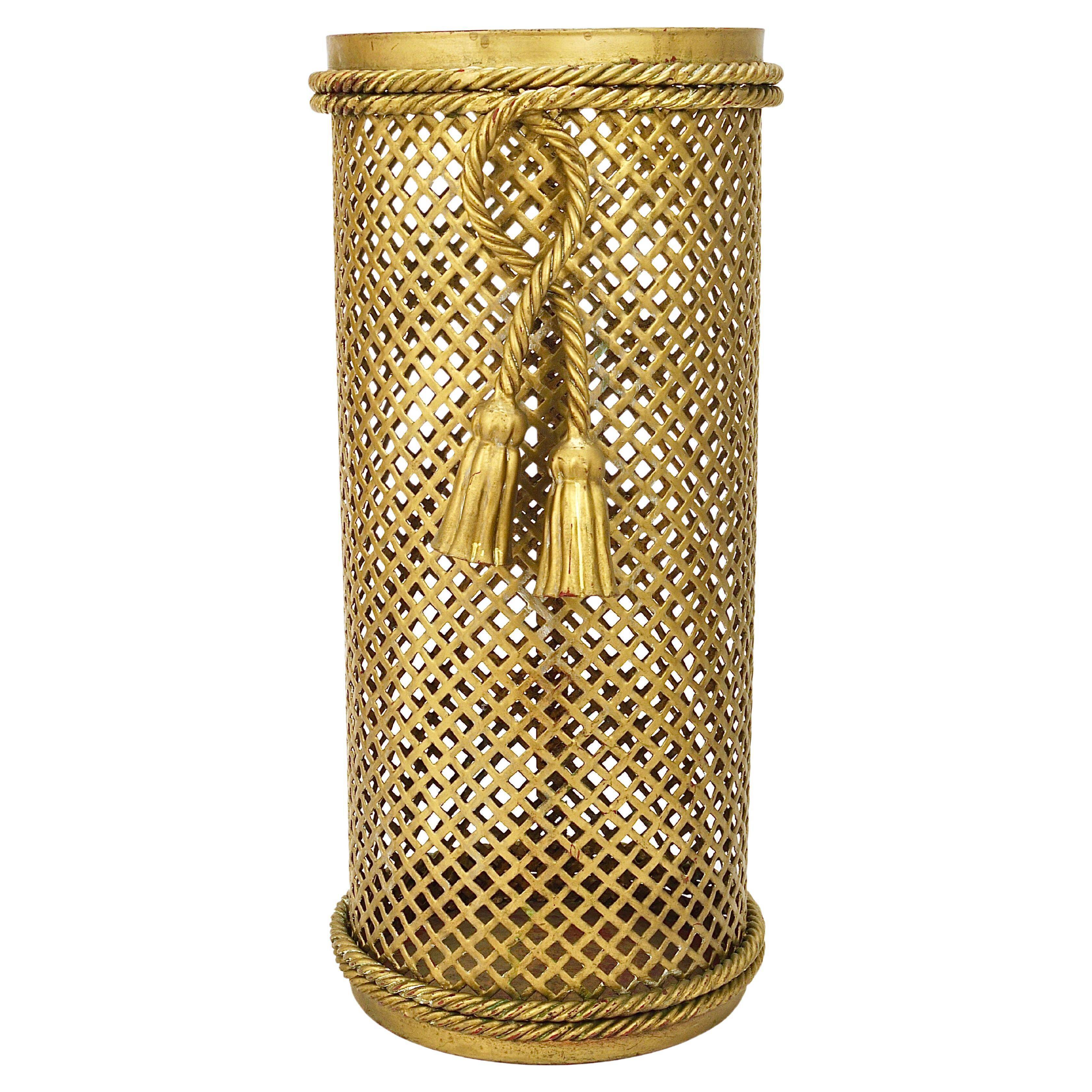 Hollywood Regency umbrella stand in gold metal with cord and tassels, Li Puma Firenze, 1950.