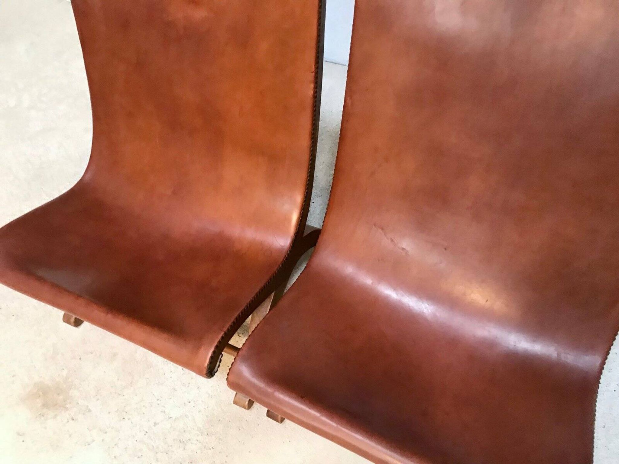 Set of 2 Spanish high-back leather slipper chairs by Pierre Lottier, 1950s