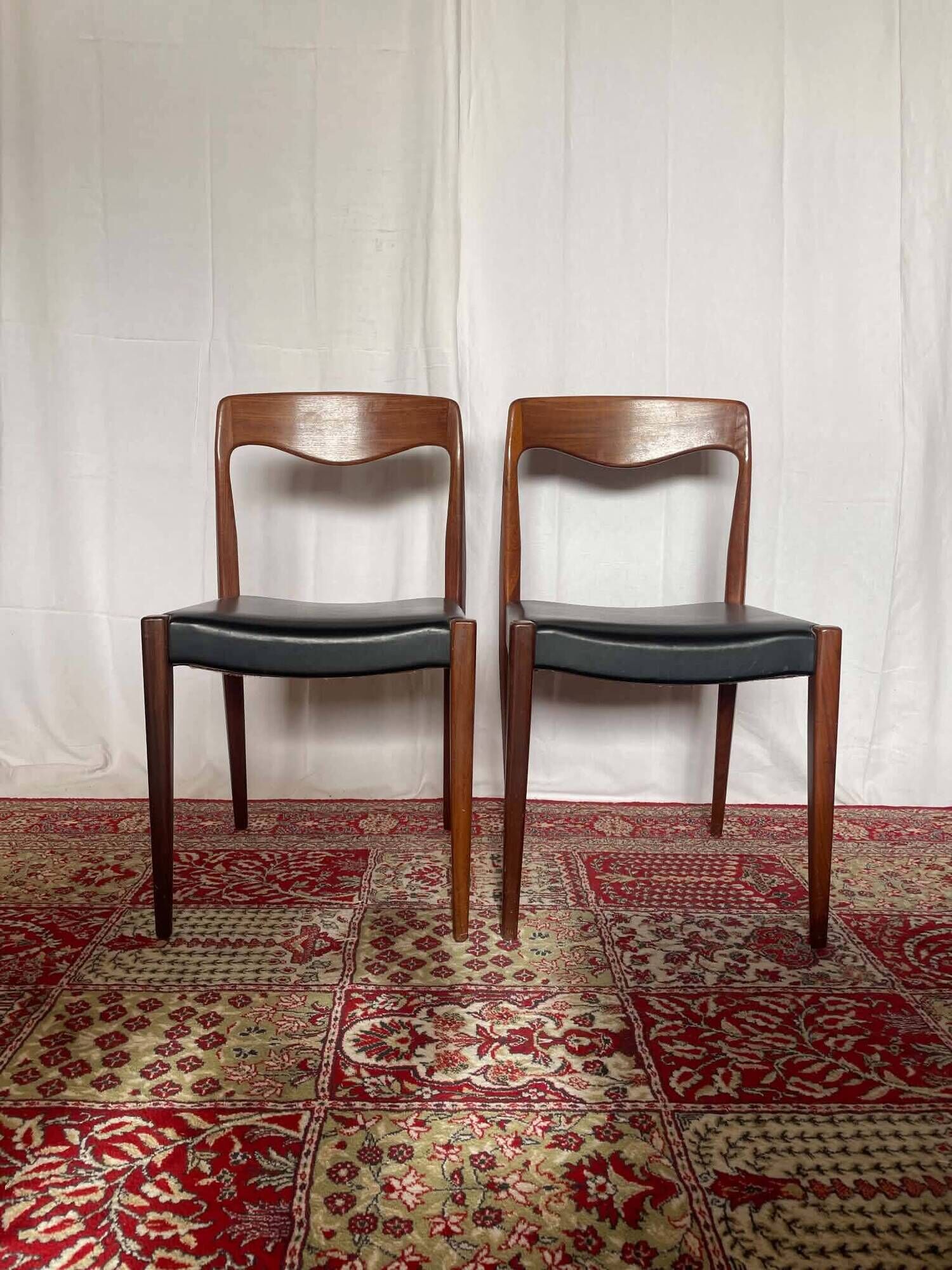 Pair of vintage teak chairs with black faux leather – Scandinavian style