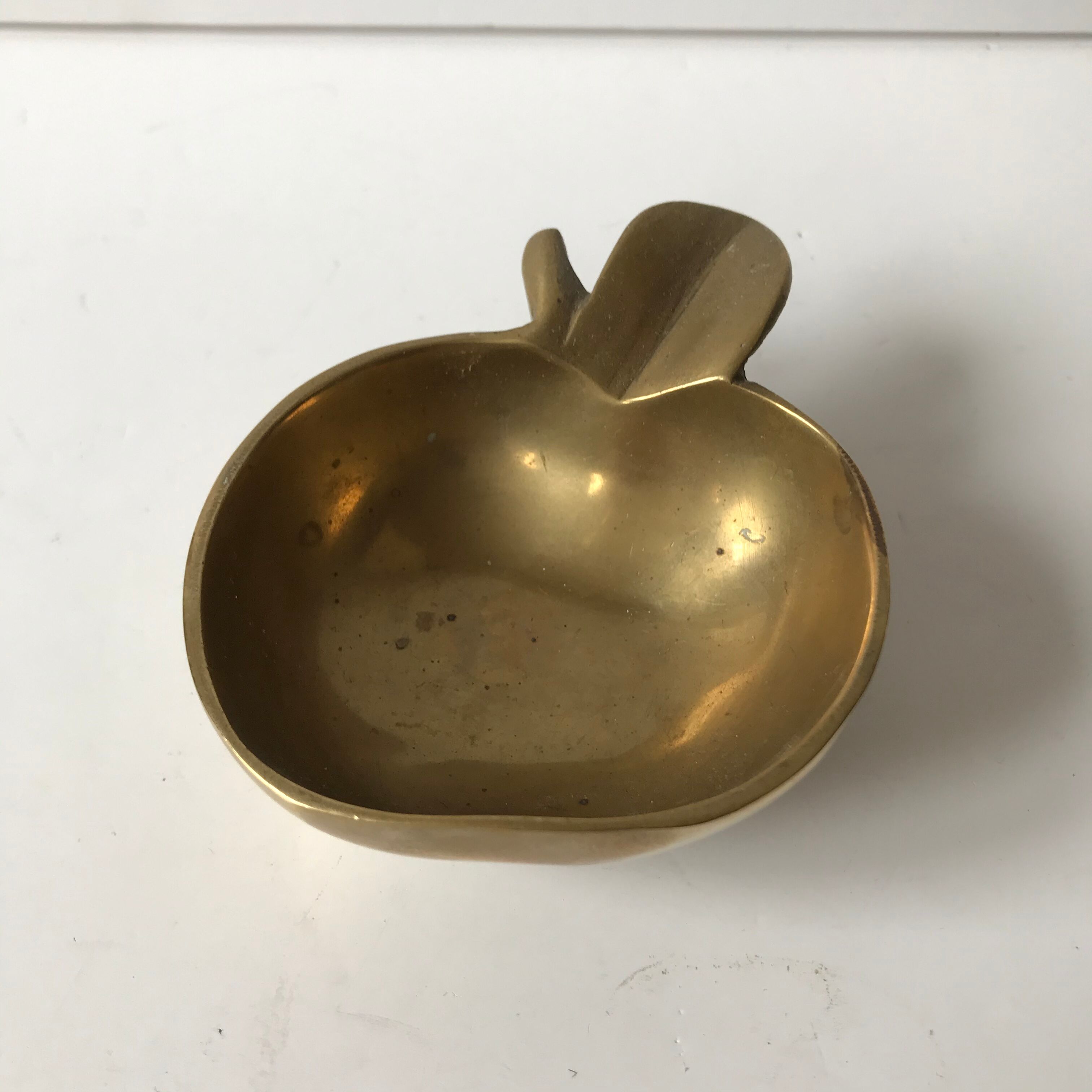 Apple brass ashtray