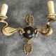 Antique bronze wall light with arm decorated with swans and palmettes in the Empire style