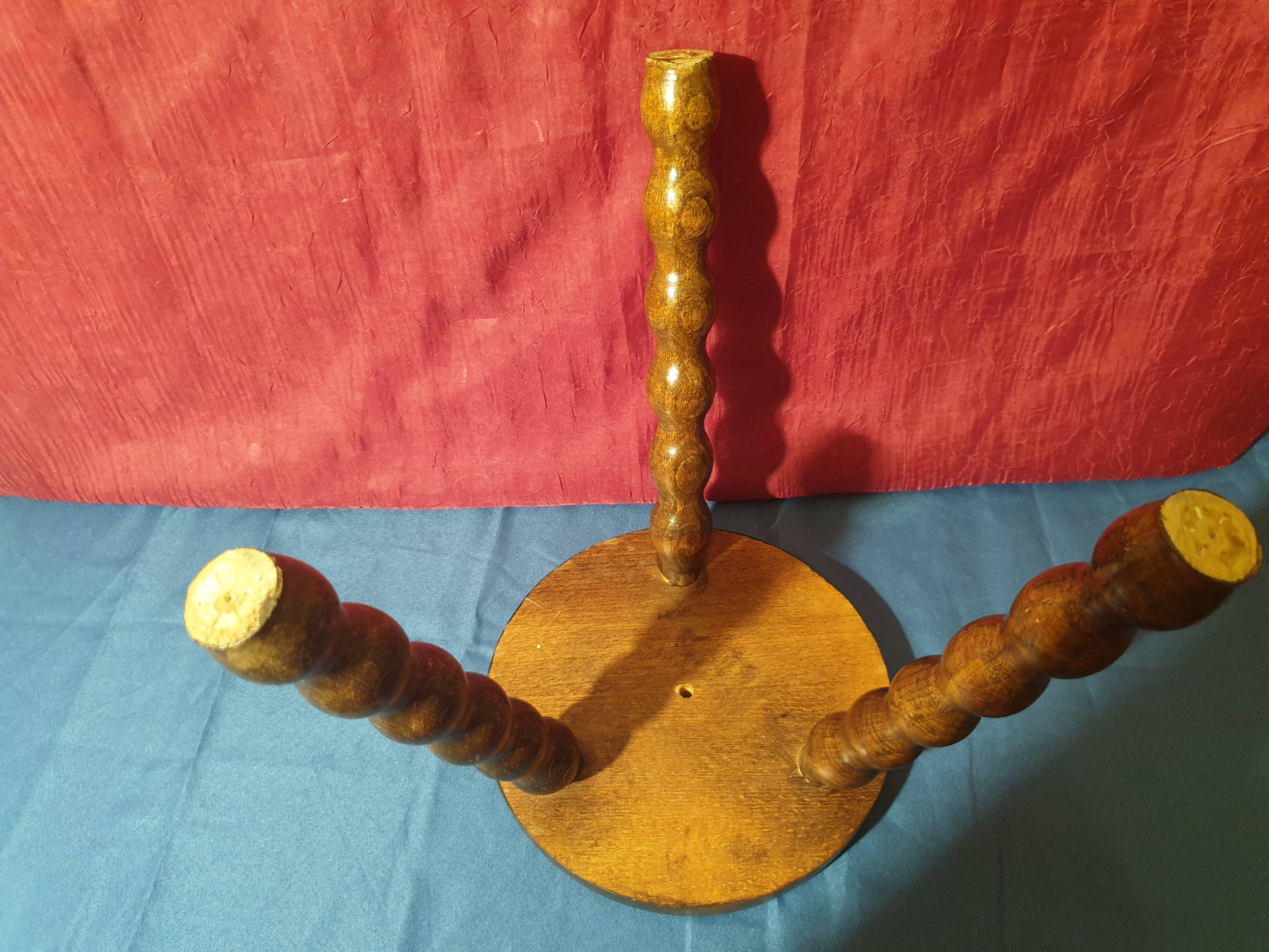 Wooden milking stool with twisted legs