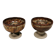 A set of ceramic candle holders in earthy colours.
