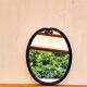 Vintage enameled blue oval mirror